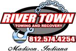 Red truck door with River Town Towing and Recovery logo, phone number, and Madison, Indiana text