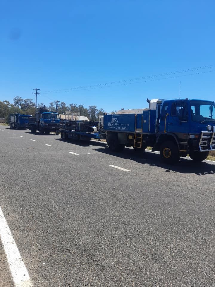 A Row of Trucks Are Parked on the Side of the Road — Cheyenne Drilling on the Sunshine Coast, QLD