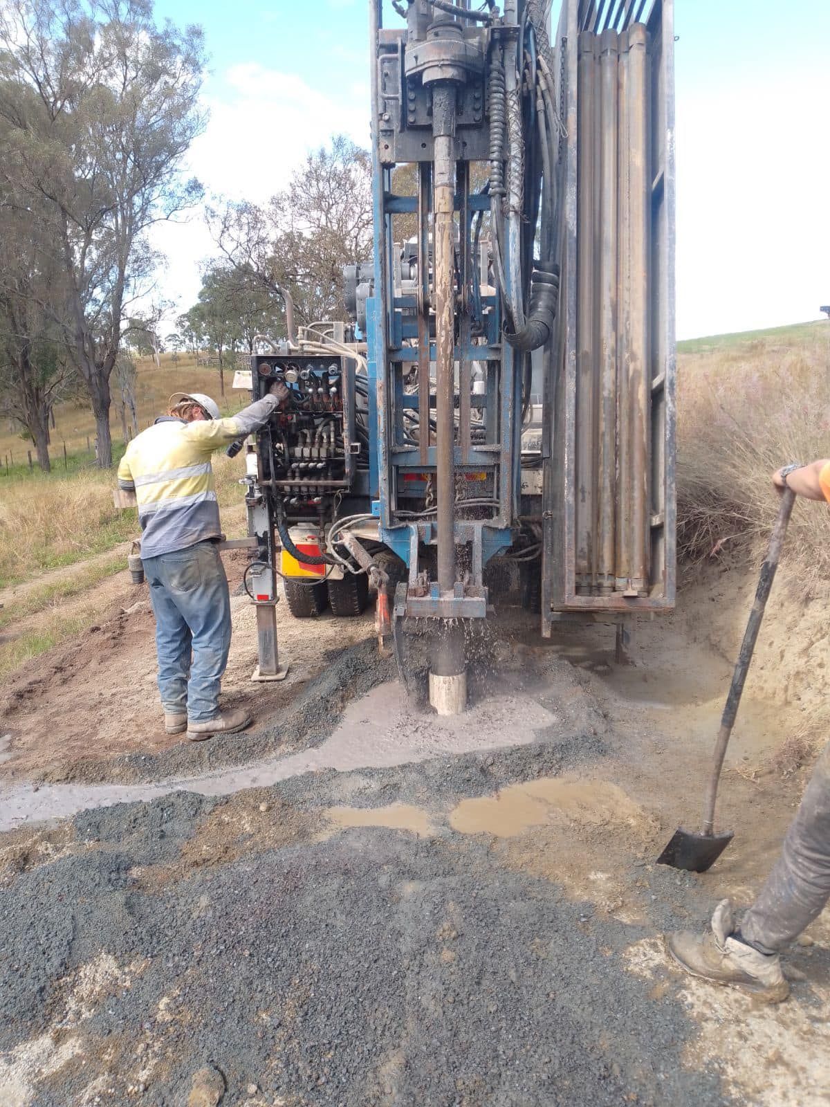 A Metal Pole is Sitting in the Middle of a Dirt Field — Cheyenne Drilling on the Sunshine Coast, QLD