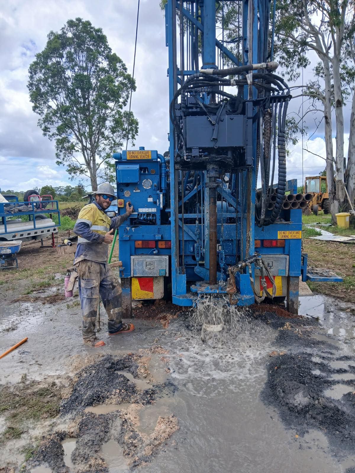 A Metal Pole is Sitting in the Middle of a Dirt Field — Cheyenne Drilling on the Sunshine Coast, QLD