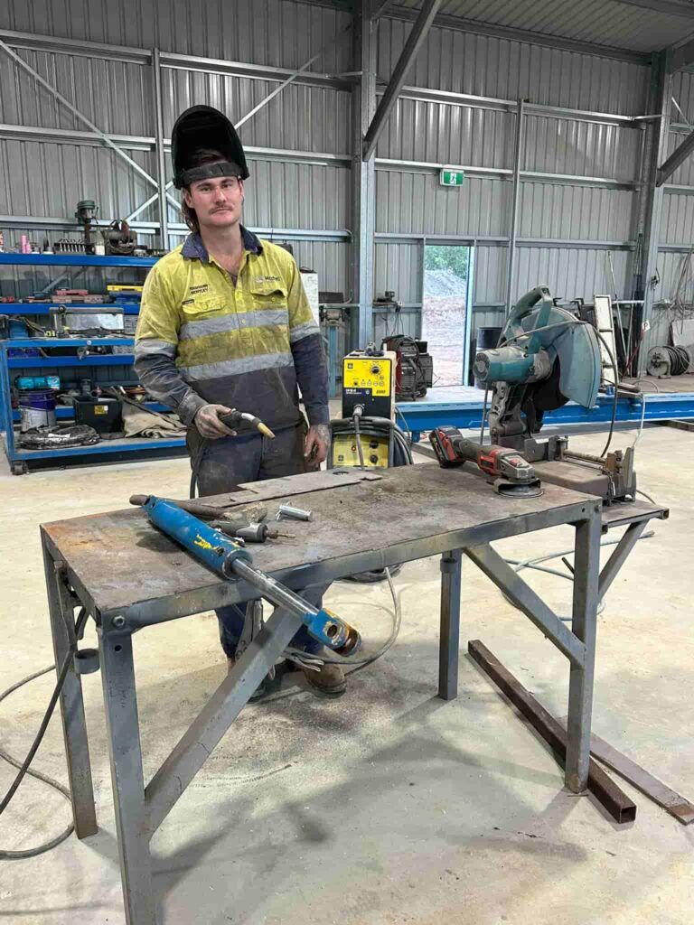 A Man is Standing in Front of a Welding Table in a Factory — Cheyenne Drilling on the Sunshine Coast, QLD