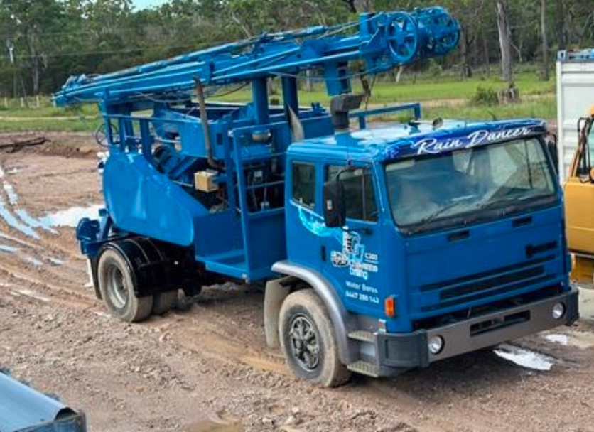 A Row of Trucks Are Parked Next to Each Other on a Dirt Road — Cheyenne Drilling on the Sunshine Coast, QLD