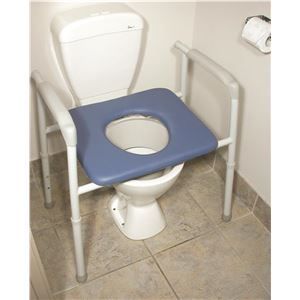 A toilet with a blue cushion on top of it.