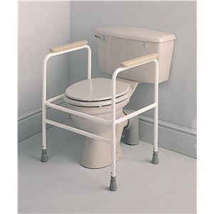A toilet with a chair attached to it in a bathroom.