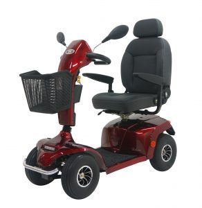 A red mobility scooter with a basket on the front is on a white background.