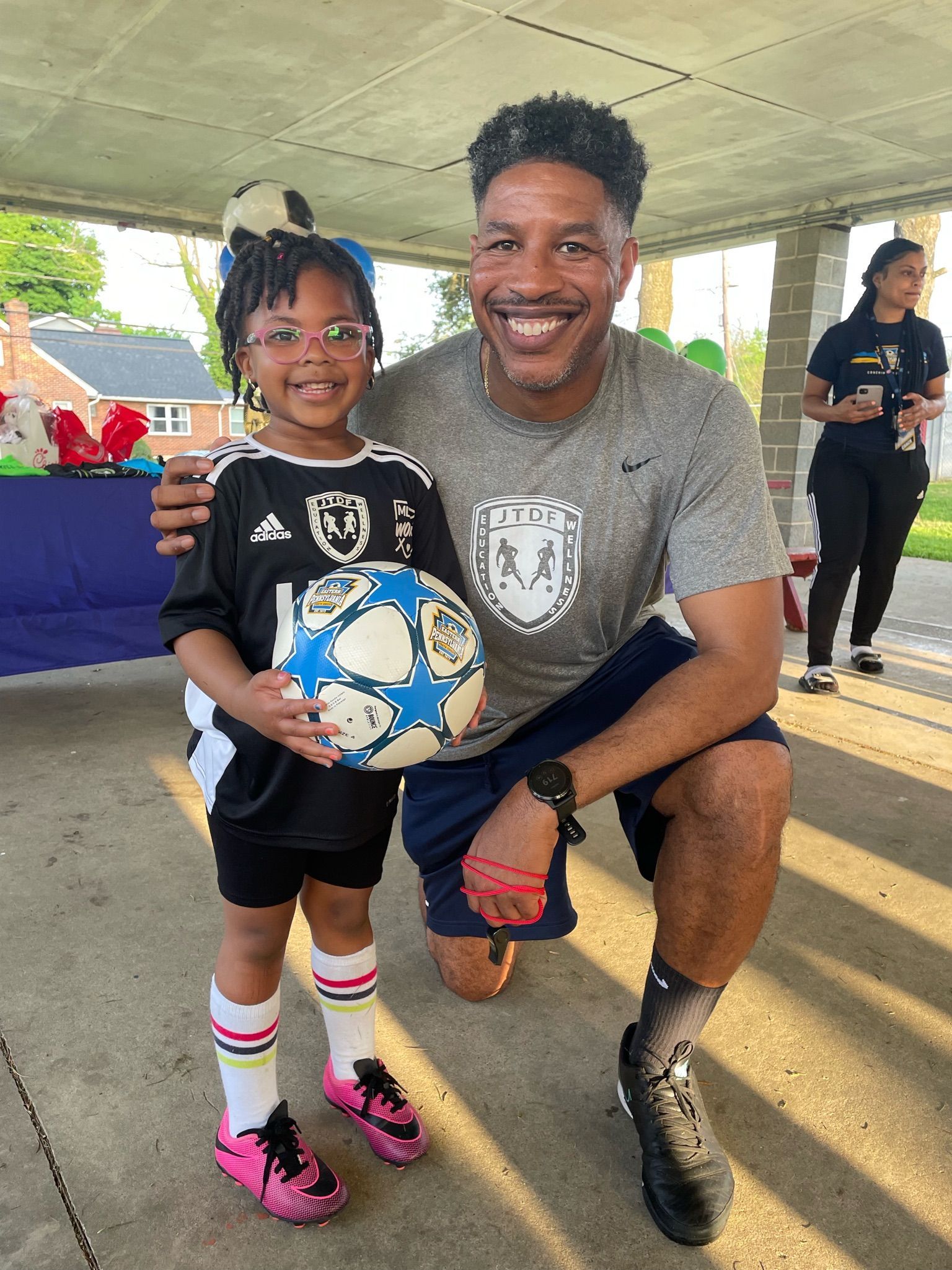JT Dorsey and a youth soccer player from the foundation 