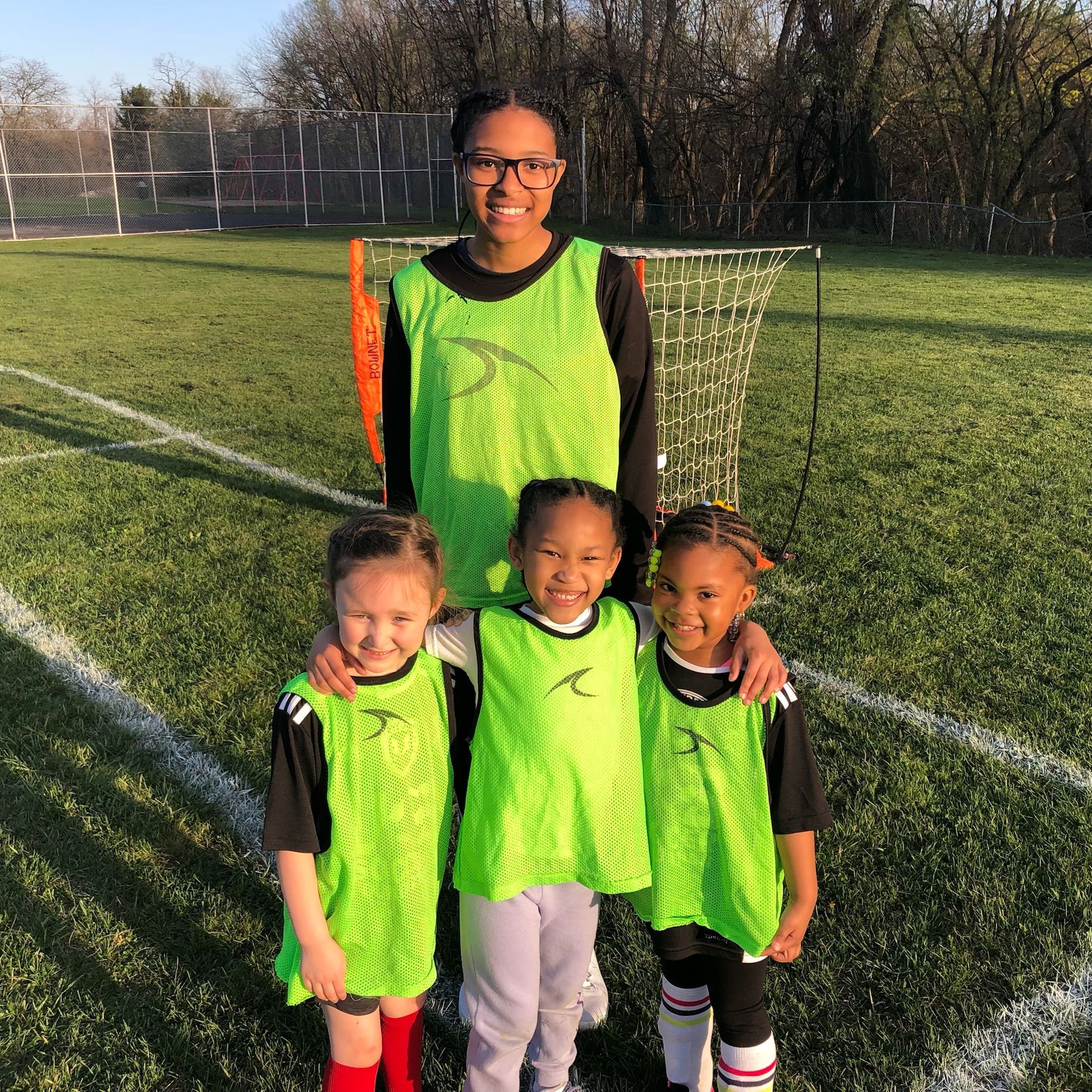 Soccer For Success youth players and coach