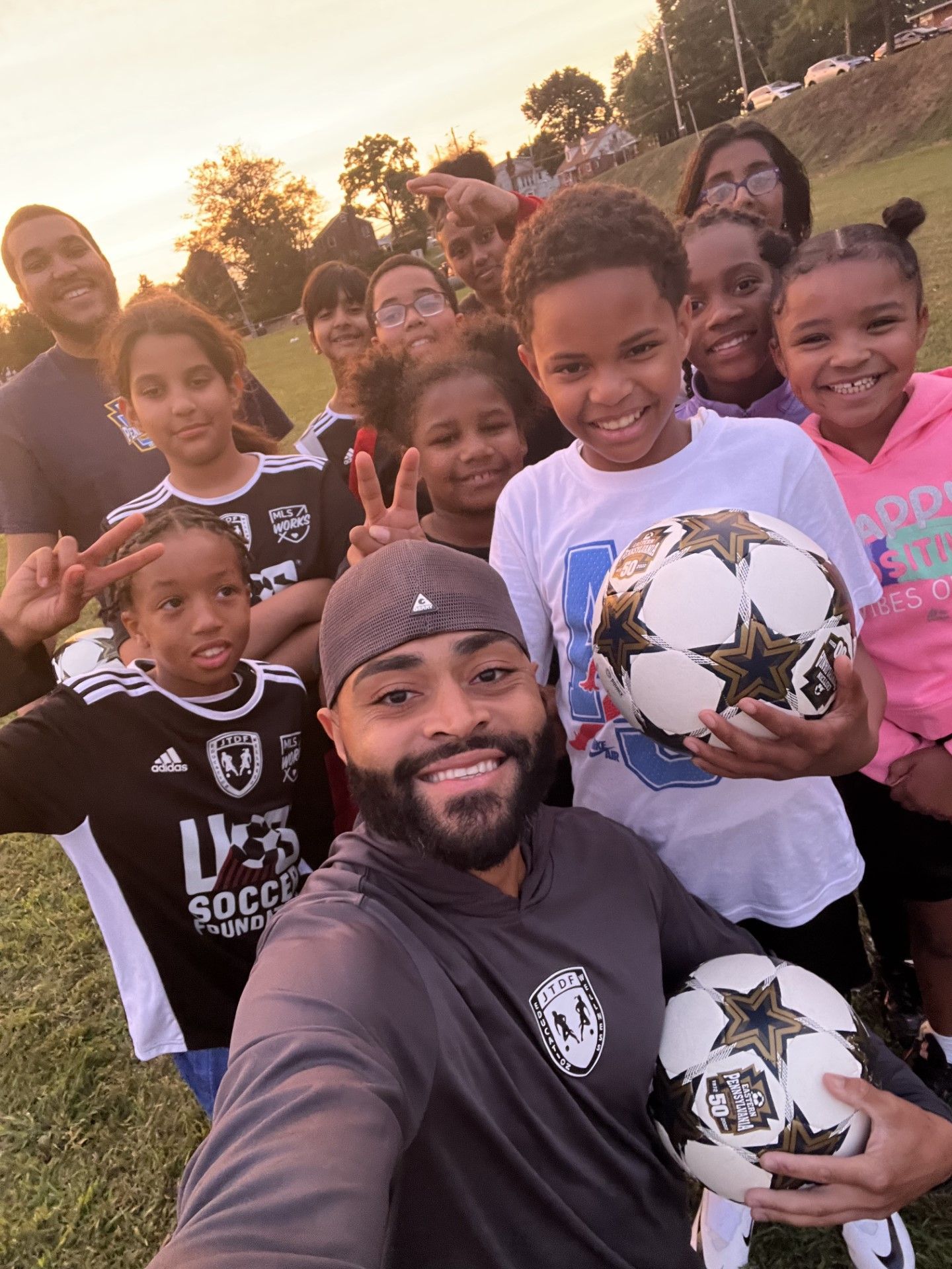 Soccer For Success youth players and coach