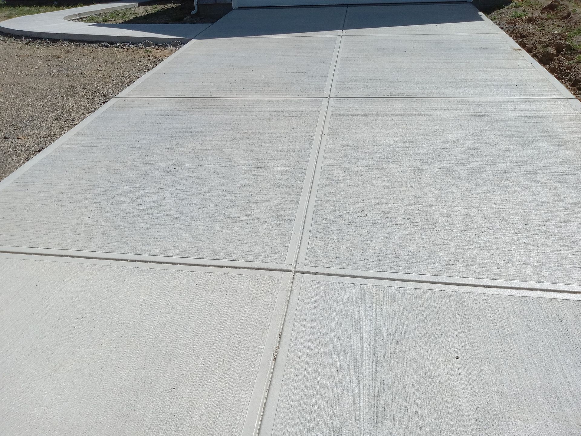 A brick walkway leading to a building in a park