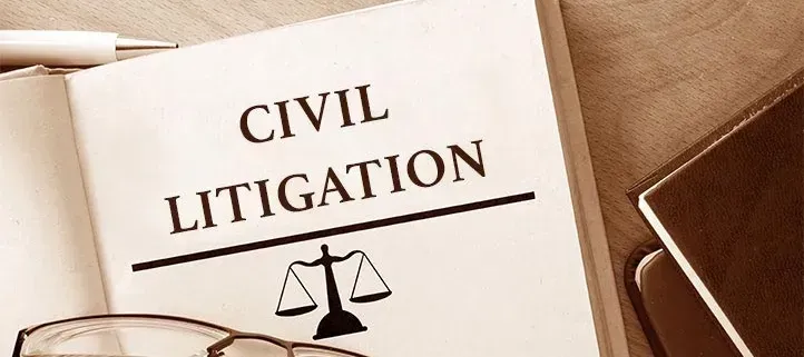 A book is open to a page that says civil litigation.