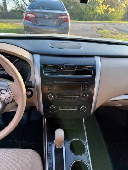 Car interior view from the driver’s seat, showing the dashboard, center console, and a car ahead on the road.
