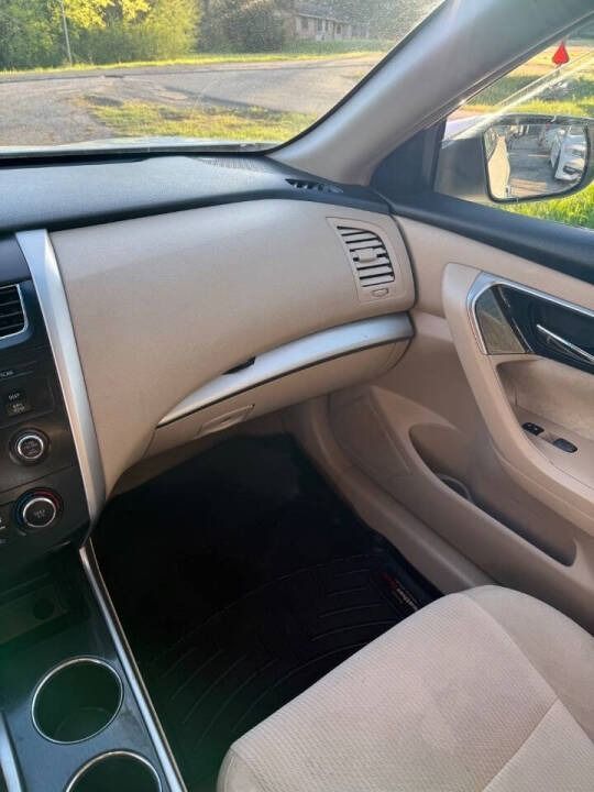 Car interior view of beige dashboard, glovebox, and passenger door with road visible through the windshield