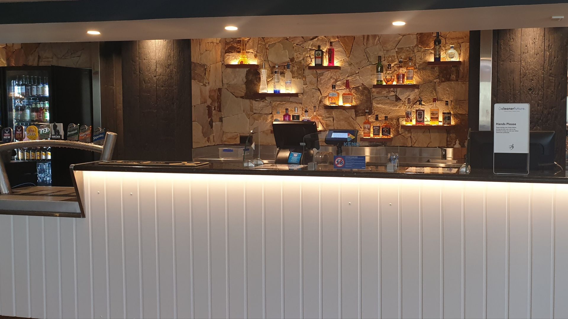 Bar With White Paneling, Stone-textured Backdrop — Rob Ward Electrical Services in Byron Bay, NSW