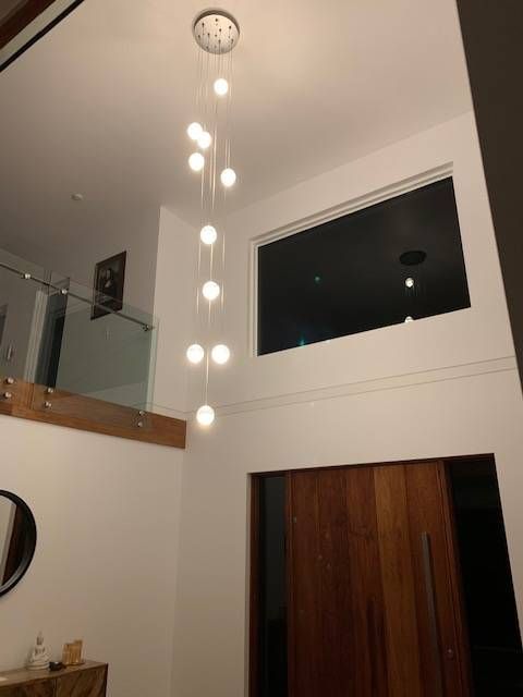 Modern Entryway With a Multi-light Pendant Lamp — Rob Ward Electrical Services in Lennox Head, NSW