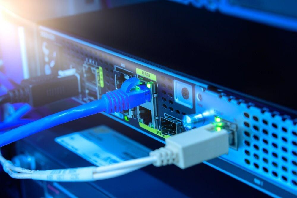 A Close Up of a Ethernet Cable Plugged Into a Server — Rob Ward Electrical Services in Ballina, NSW