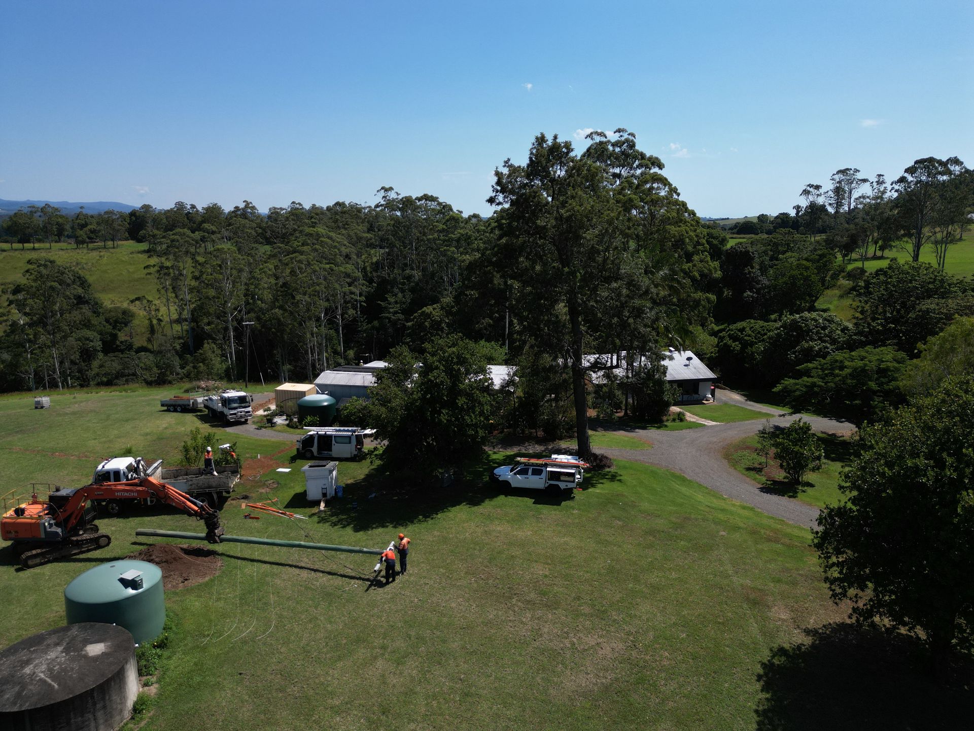 Aerial View of a Rural Property With an Excavator Digging — Rob Ward Electrical Services in Brunswick Heads, NSW