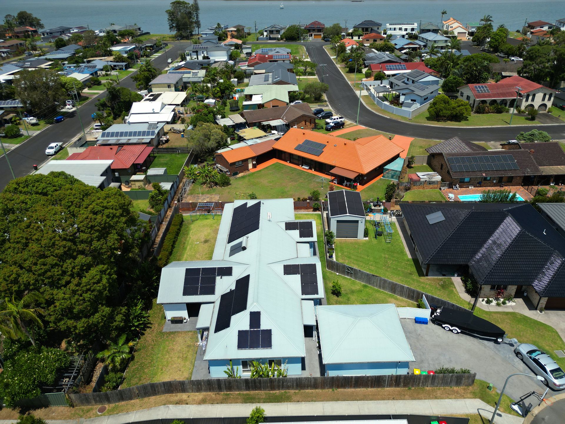 Aerial View of Suburban Homes With Solar Panels on Rooftops — Rob Ward Electrical Services in Byron Bay, NSW
