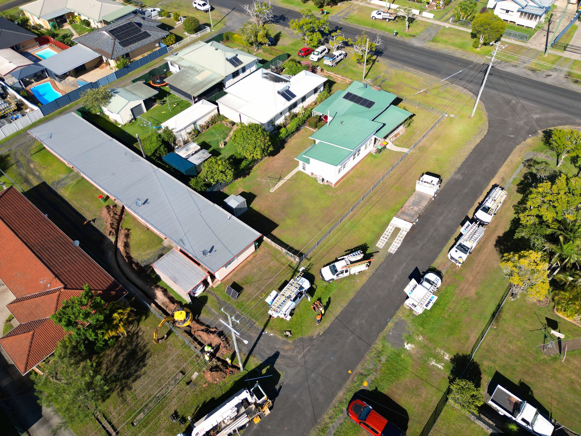 Aerial View of Suburban Homes, a Long Building — Rob Ward Electrical Services in Mullumbimby, NSW