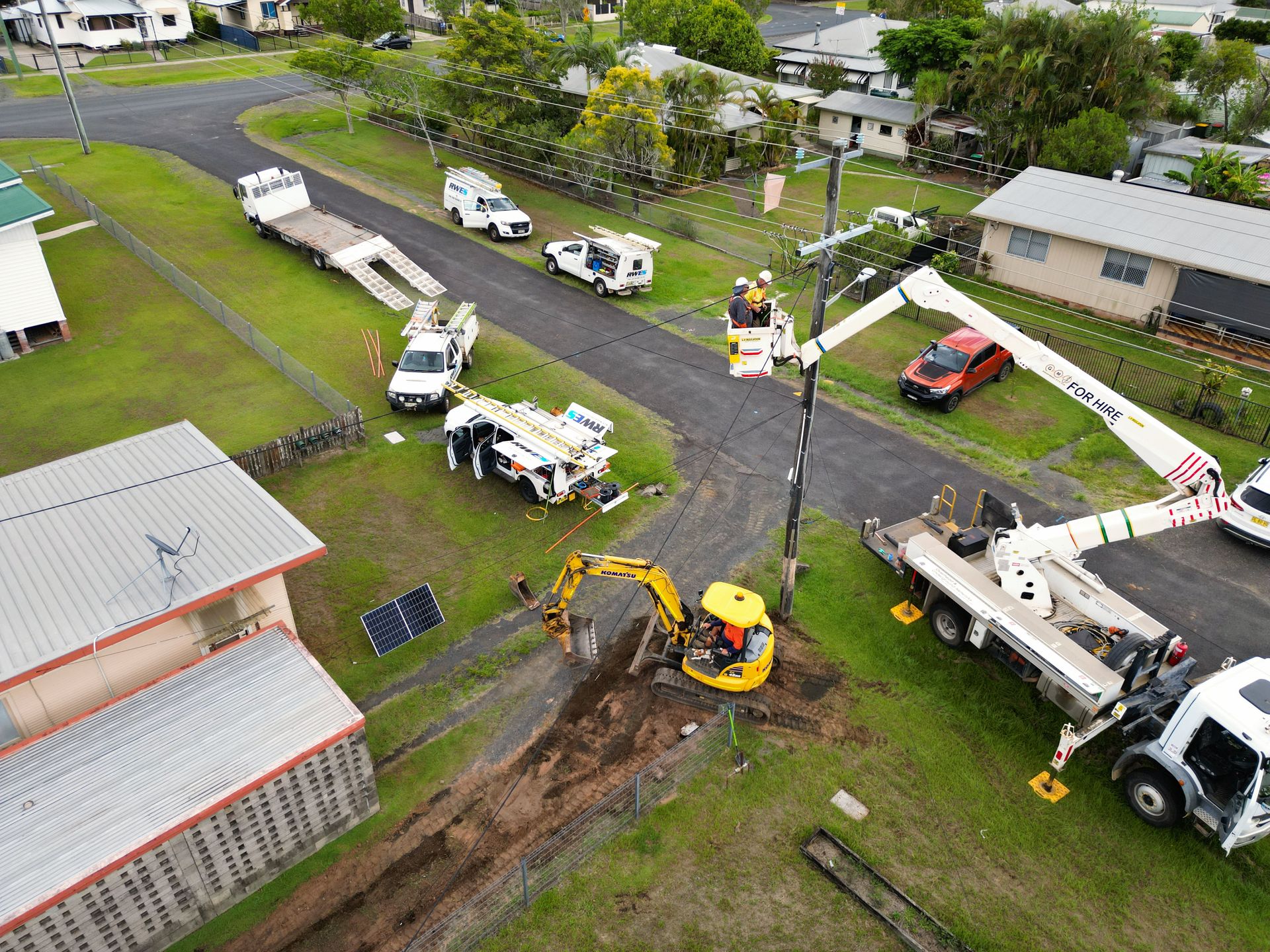 Utility Crews Working on Power Lines, Using Trucks and Machinery — Rob Ward Electrical Services in Kingscliff, NSW