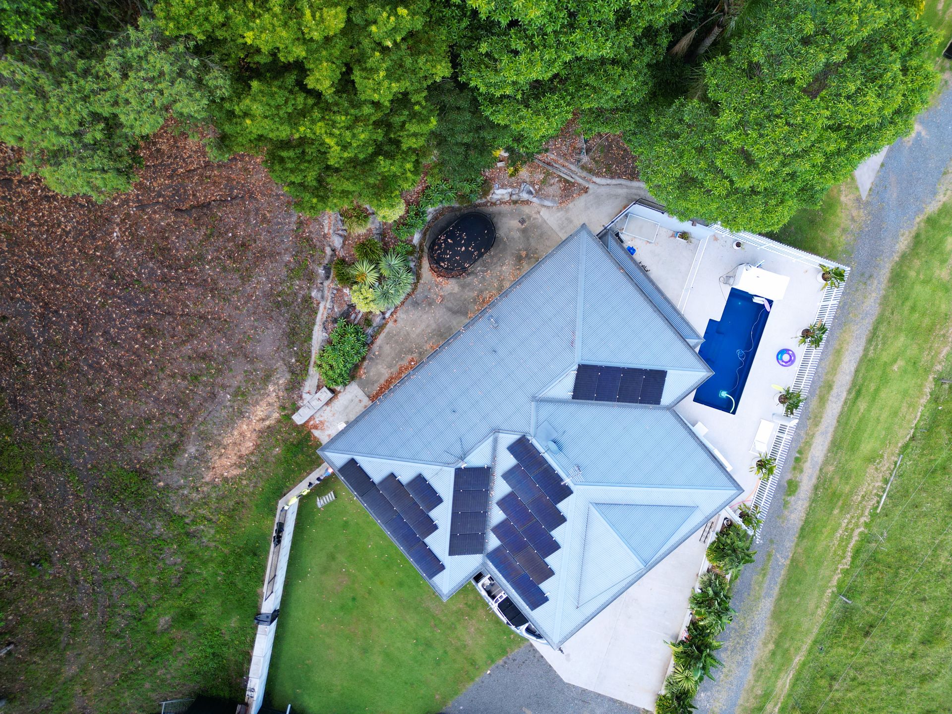 Aerial View of a House With a Gray Roof, and Solar Panels — Rob Ward Electrical Services in Brunswick Heads, NSW