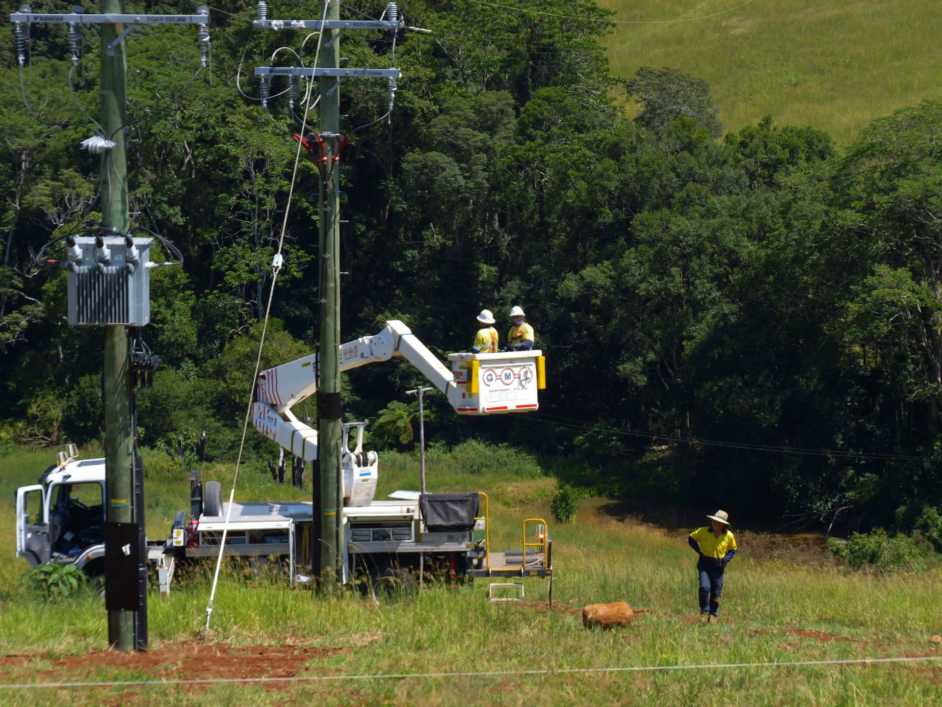 Utility Workers in Lift Truck, Repairing Power Lines — Rob Ward Electrical Services in Lismore, NSW