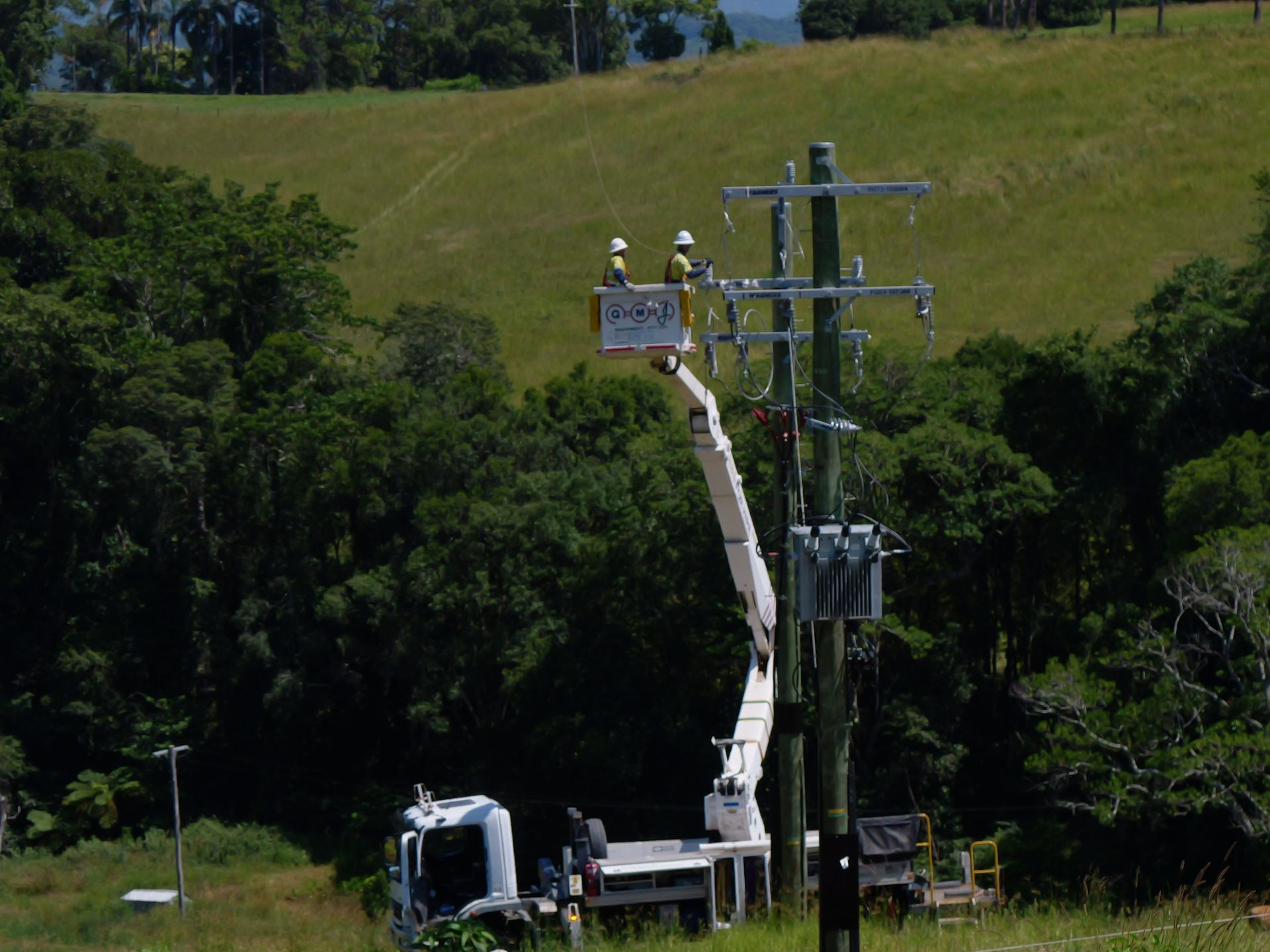 Two Workers in a Bucket Lift Repairing a Power Pole — Rob Ward Electrical Services in Evans Head, NSW