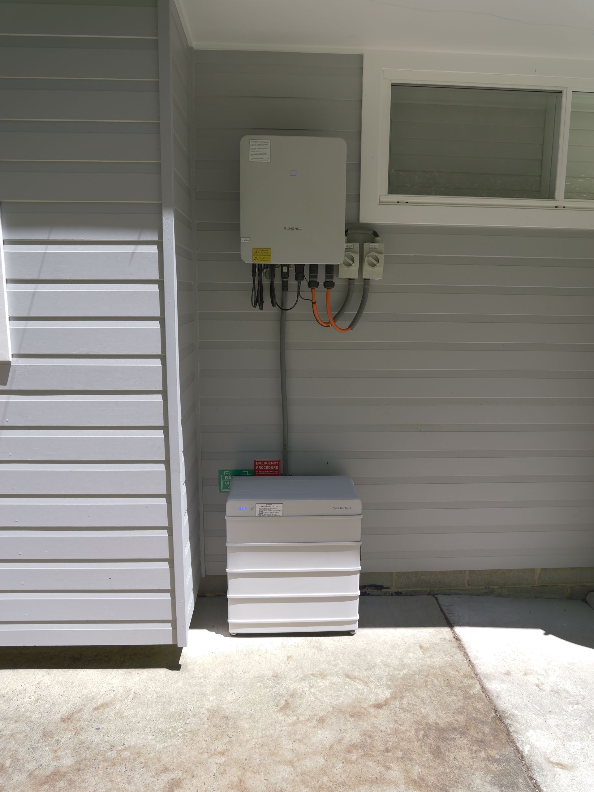 Solar Power Inverter and Battery Installed Outdoors — Rob Ward Electrical Services in Ballina, NSW