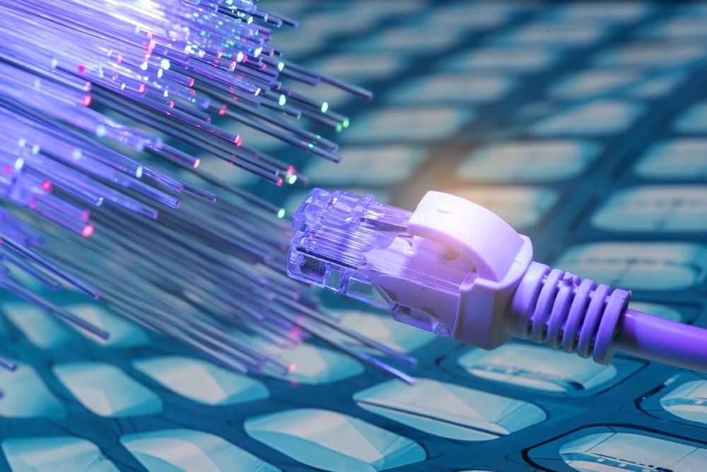 A Close Up of a Purple Ethernet Cable on a Keyboard — Rob Ward Electrical Services in Kingscliff, NSW
