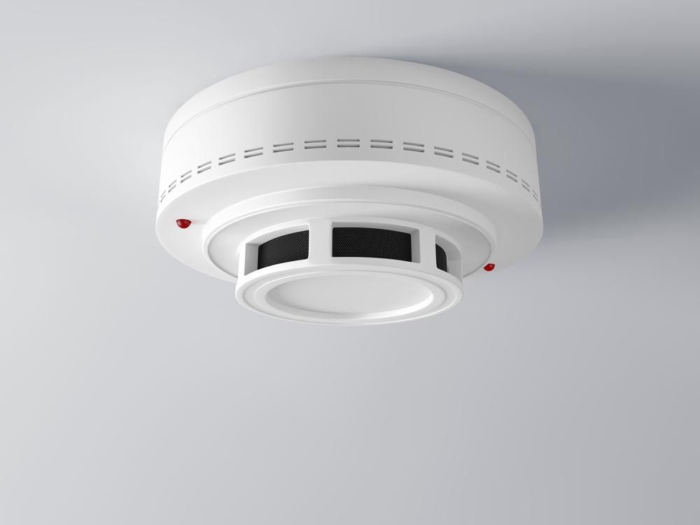 A White Smoke Detector is Mounted to the Ceiling — Rob Ward Electrical Services in Broadwater, NSW