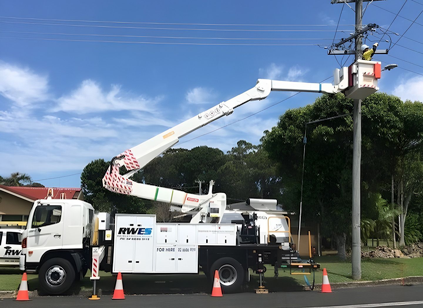 Utility Truck Repairing Power Lines During Northern Rivers Outage Preparation