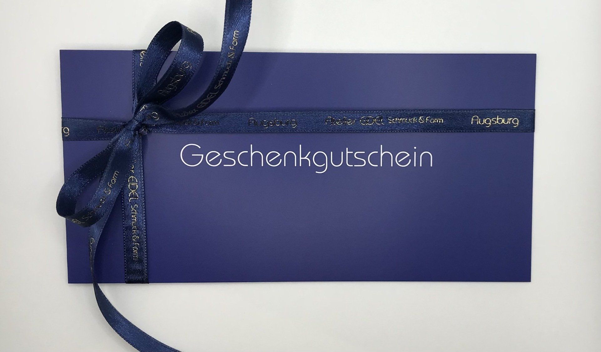 Eine blaue Geschenkkarte mit dem Wort „Geschenk“ darauf