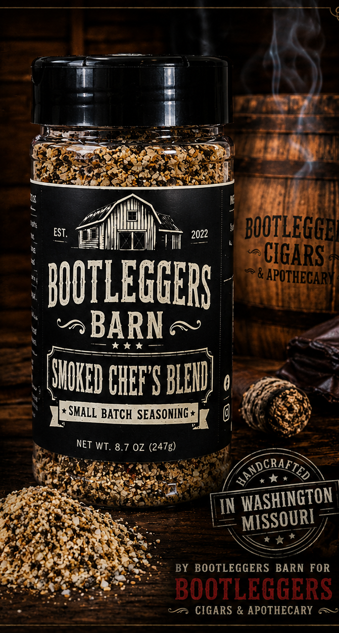 Small beige spice jar labeled “Rootleggers &… Chef’s Blend” on a wooden post outdoors.