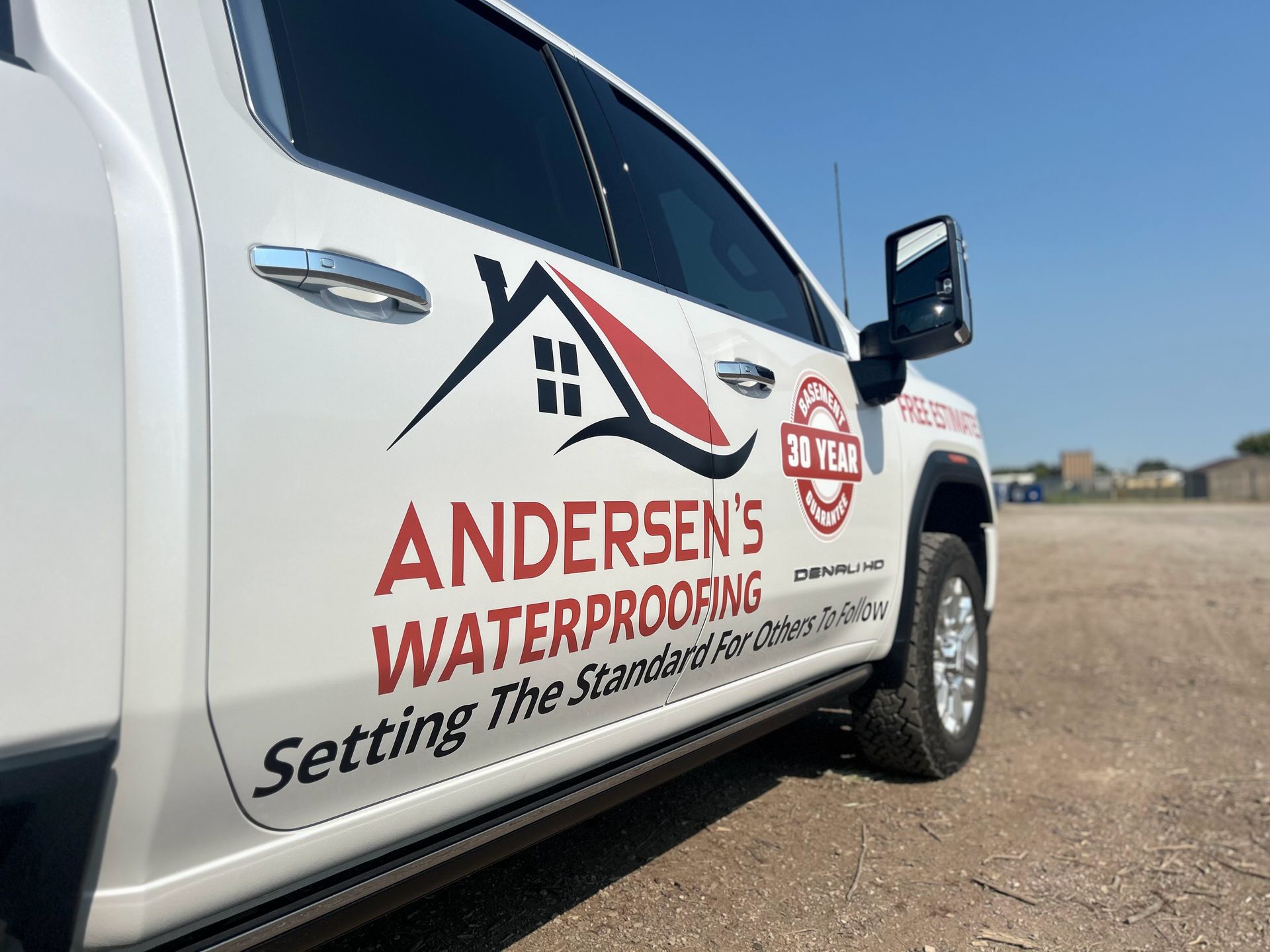 A white truck with the words andersen 's waterproofing on the side
