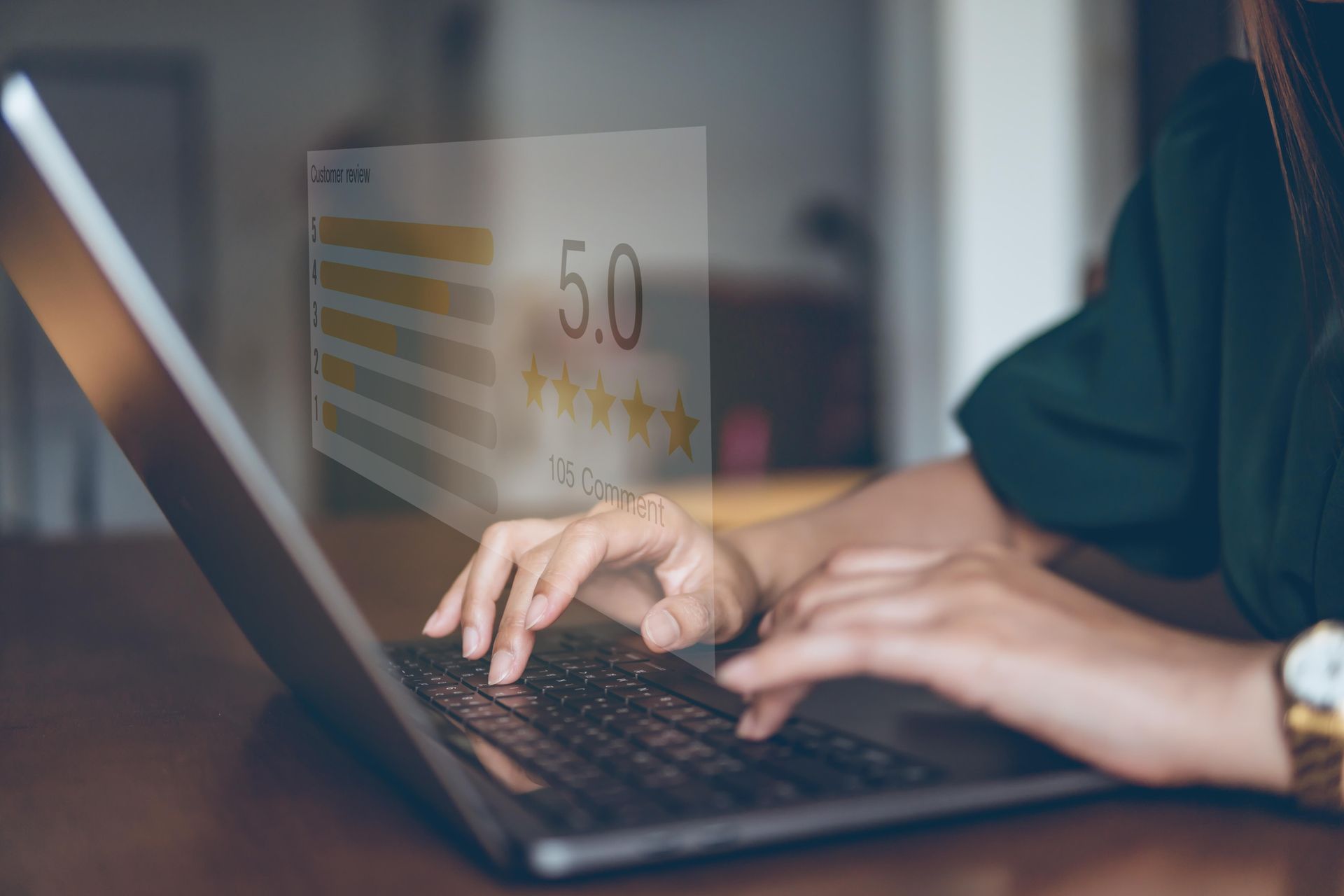 Hands typing on a laptop beside a glowing 5-star review card.