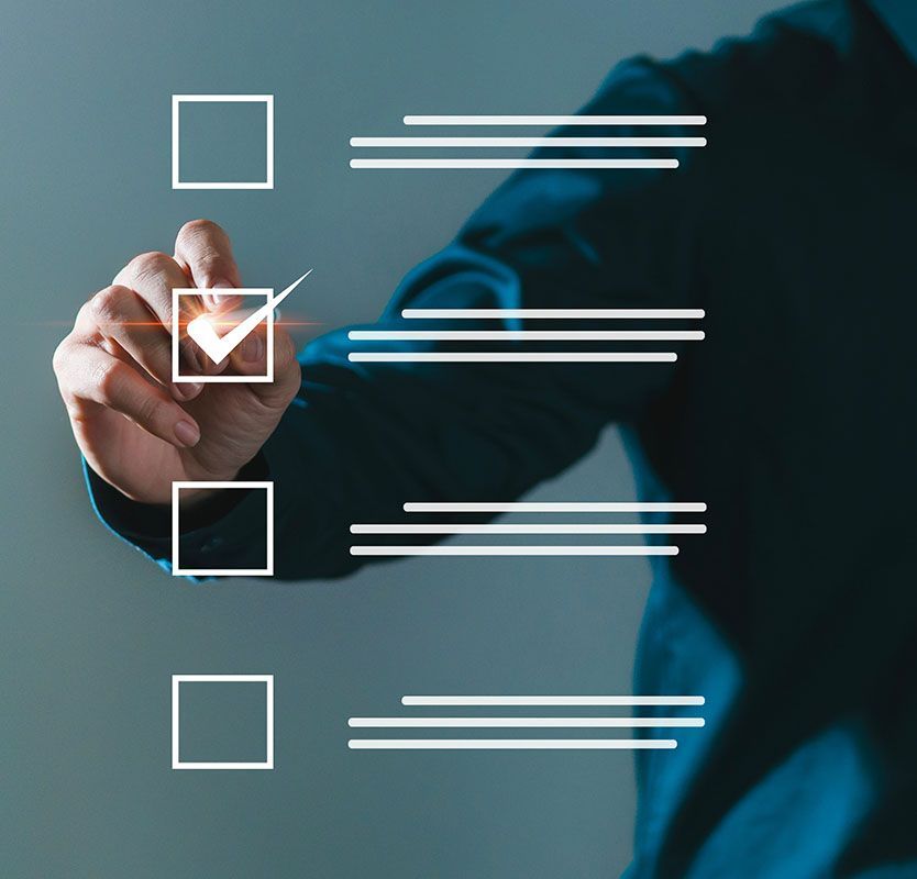 Hand checking a checkbox on a transparent checklist overlay with white lines and boxes