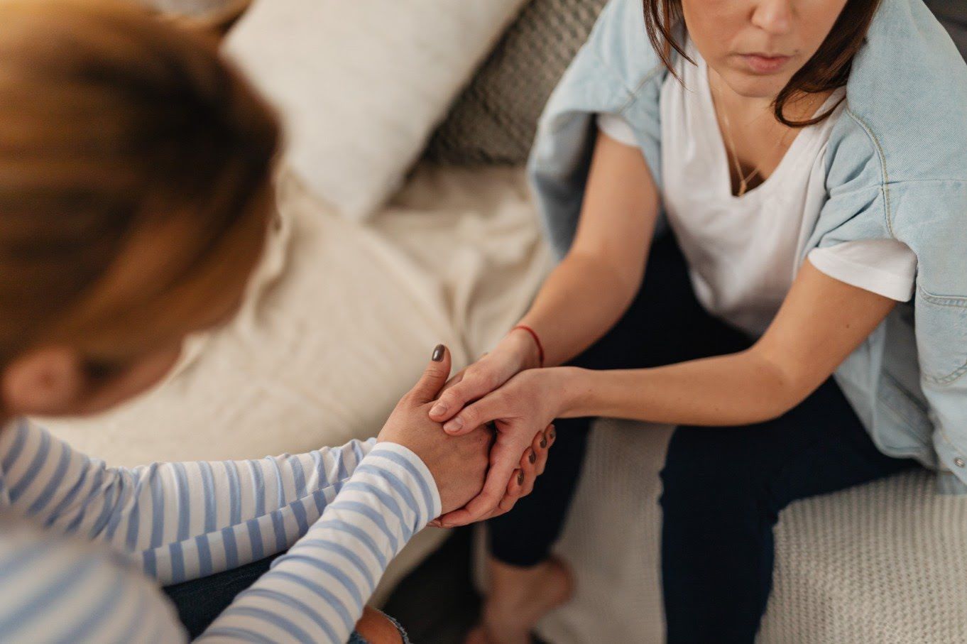 Caring hands offering comfort and support to a grieving family in Ellenton, FL