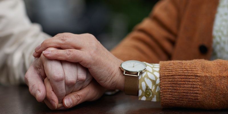 Caring hands offering comfort and support during funeral planning in Bradenton, FL