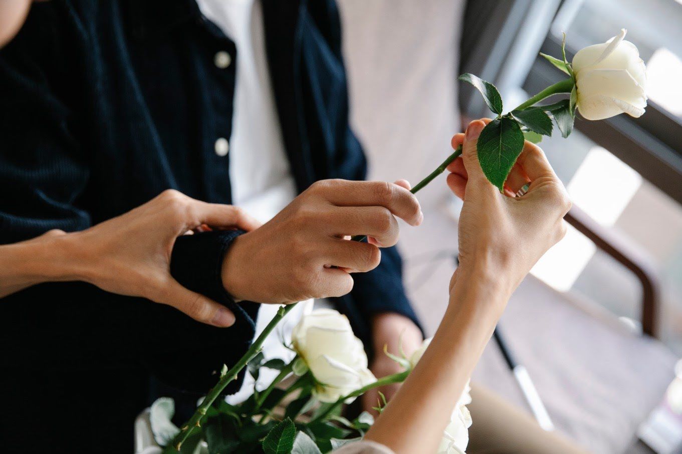 Family arranging white roses for a meaningful funeral tribute in Palmetto, FL