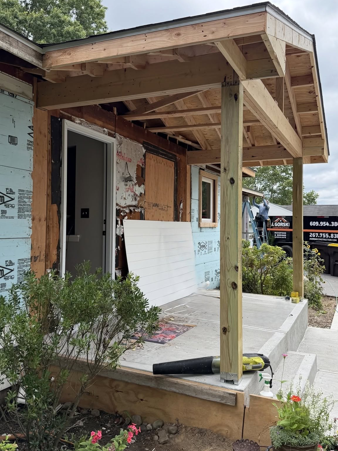 Professional roofing contractor using a pneumatic nail gun to install new asphalt shingles. Professional roofing contractor using a pneumatic nail gun to install new asphalt shingles.