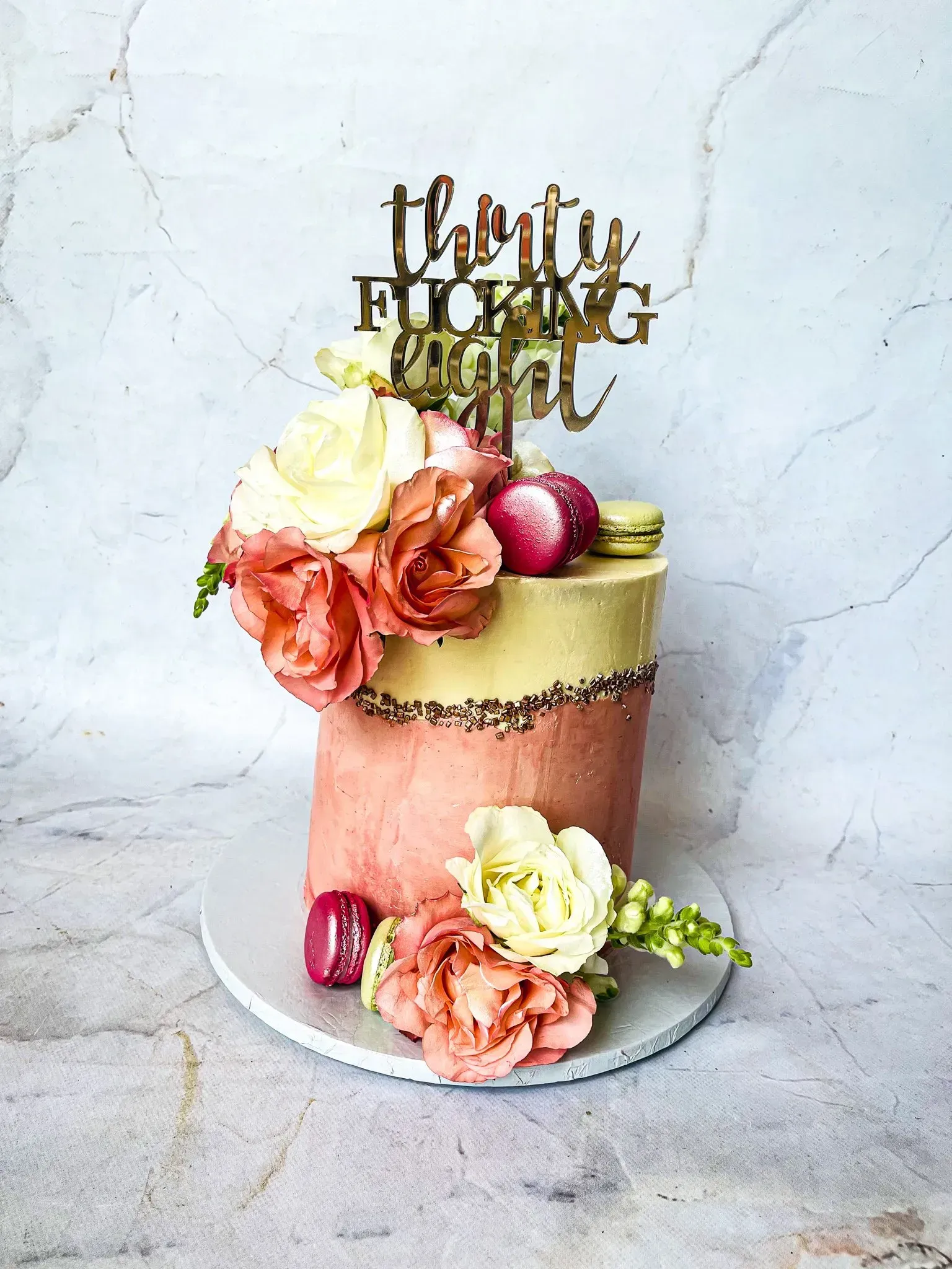 Cake decorated with flowers and a 