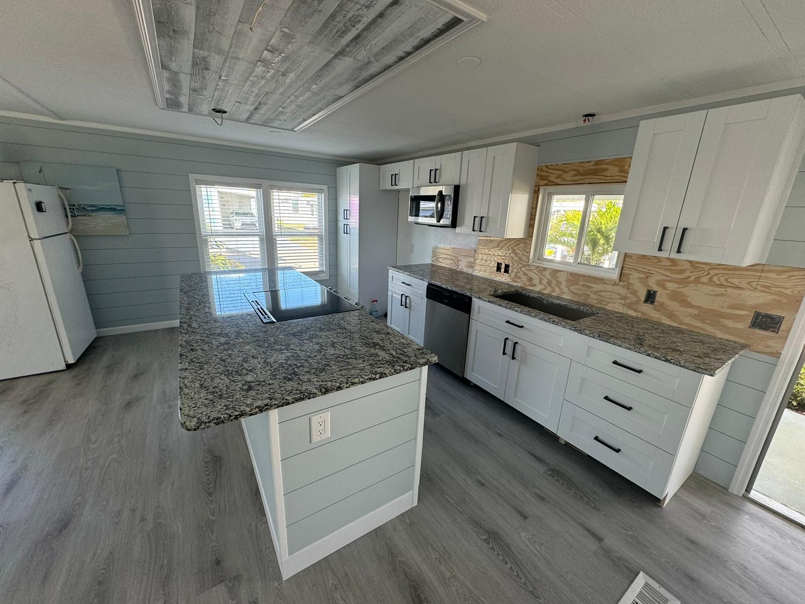 Kitchen by Roca Granite & Cabinets
