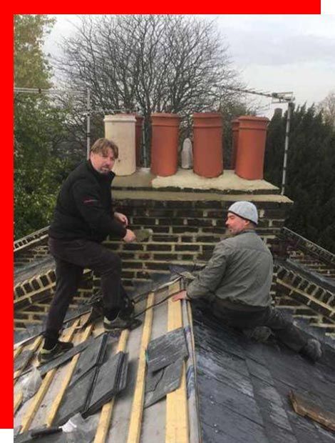two men are working on the roof of a building .