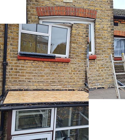 a brick building with a window and a ladder on the side