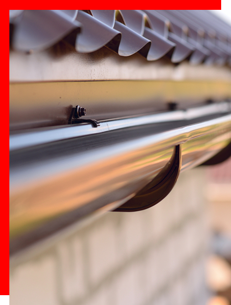 a close up of a gutter on the side of a building .