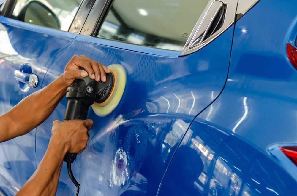 Professional Worker Doing Car Exterior Buffing