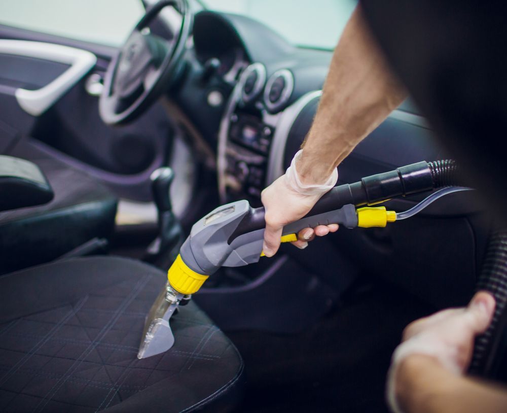 Professional Worker Doing Deep Car Interior Cleaning