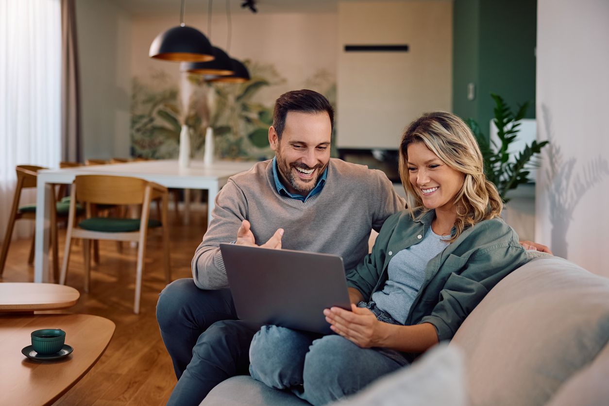 Couple looking together at a computer