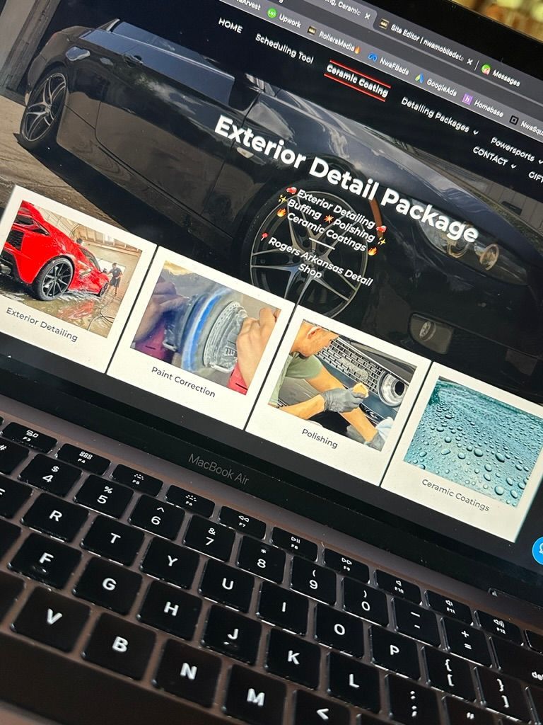 Laptop displaying a car detailing website, featuring package details and image gallery of car cleaning.