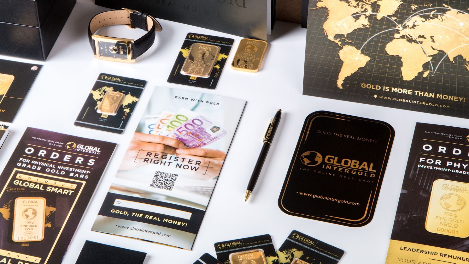 Gold bars, watch, pen, and brochures on a white surface with gold and black accents; Global InterGold branding.