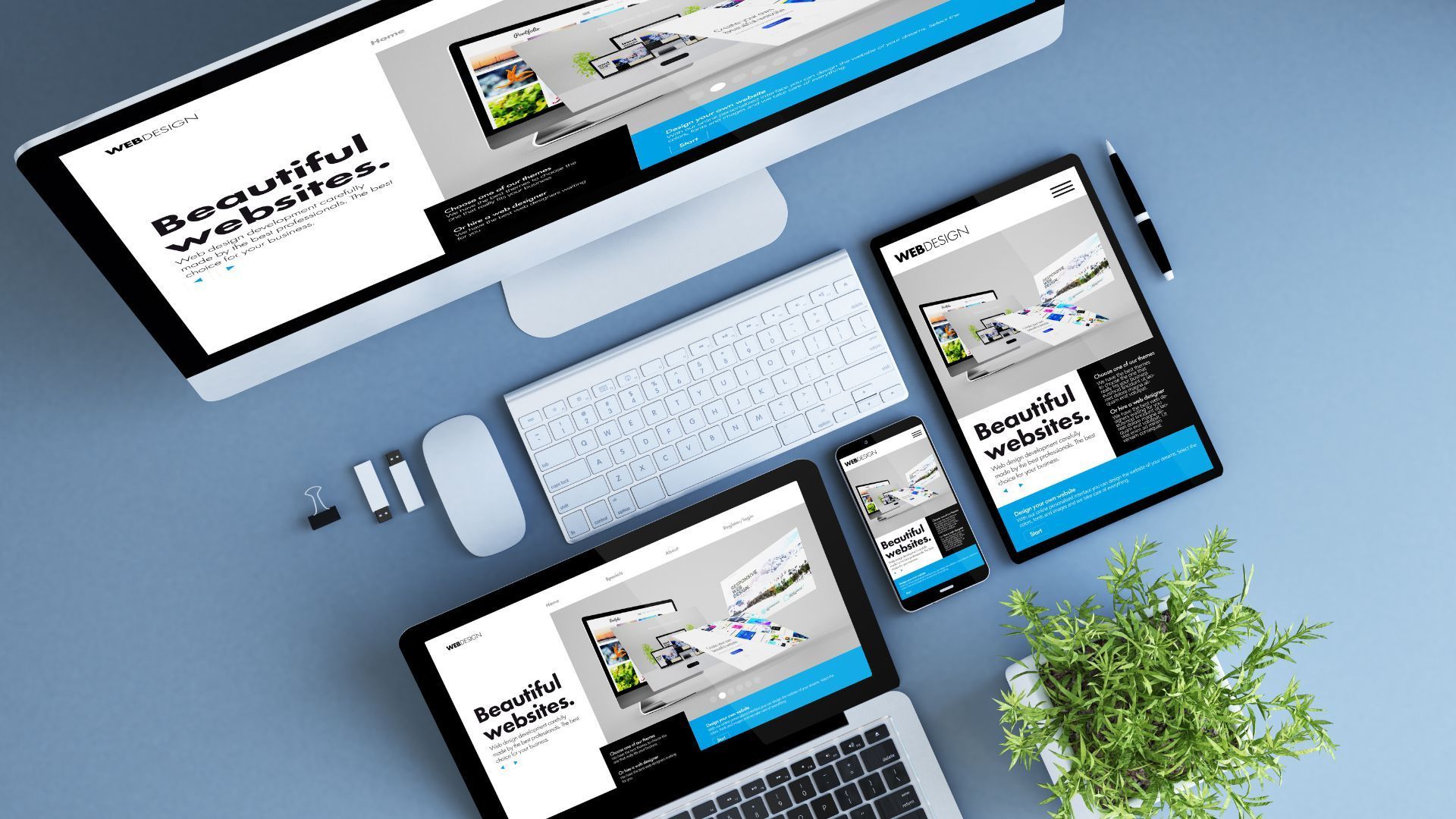Rollers Media: Laptop, phone, and tablet showcasing a website design on a wooden desk, with accessories.